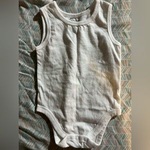 Plain white onesie. Sleeveless. Never worn.